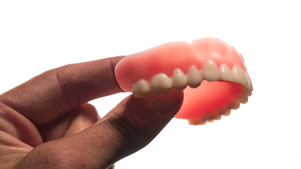 Flexera dentures being held