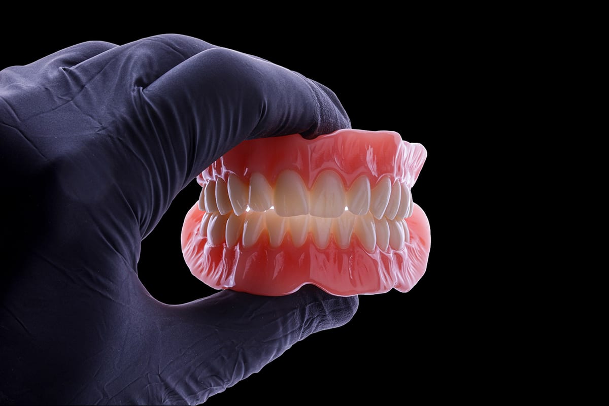 Flexcera Denture In Hand Black.jpg