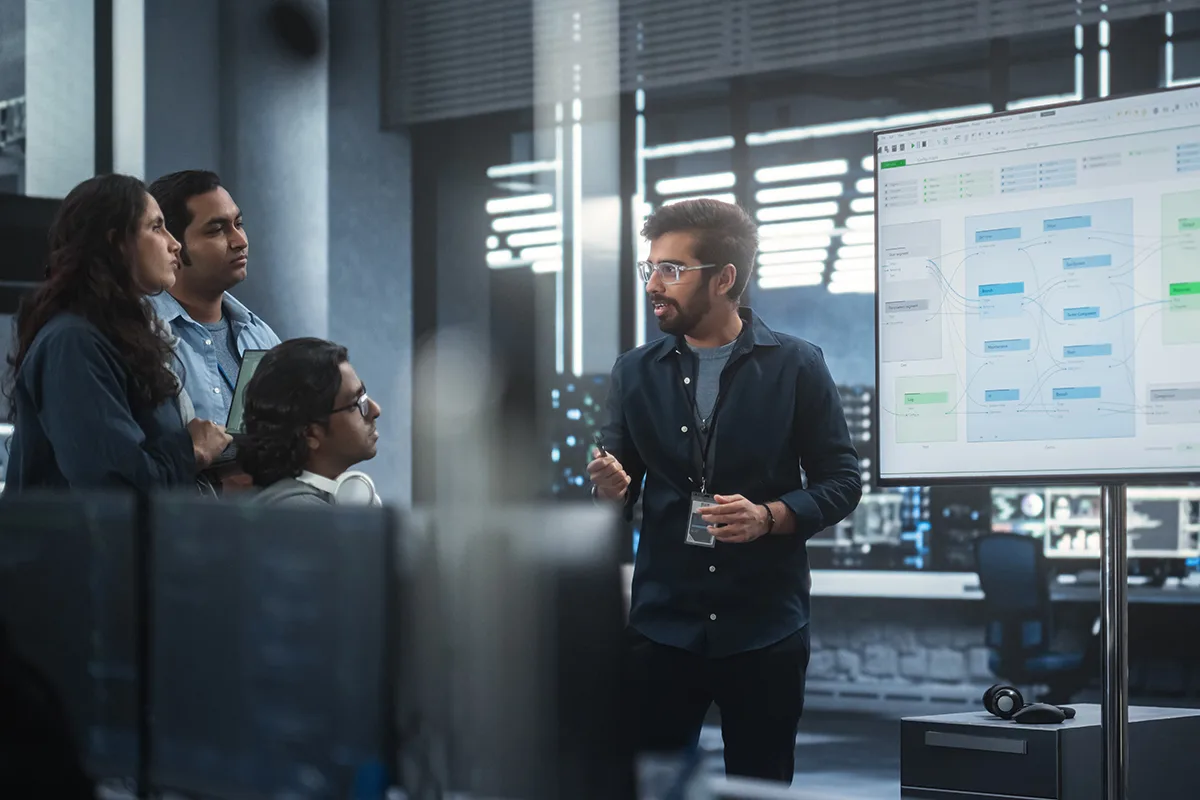 a group of software engineers discussing in the boardroom