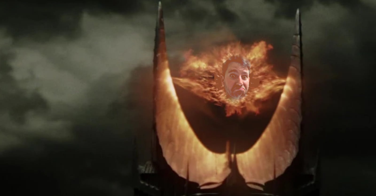 The black tower of Sauron with a big fire in the middle and the header of a man (me) in the middle of it.