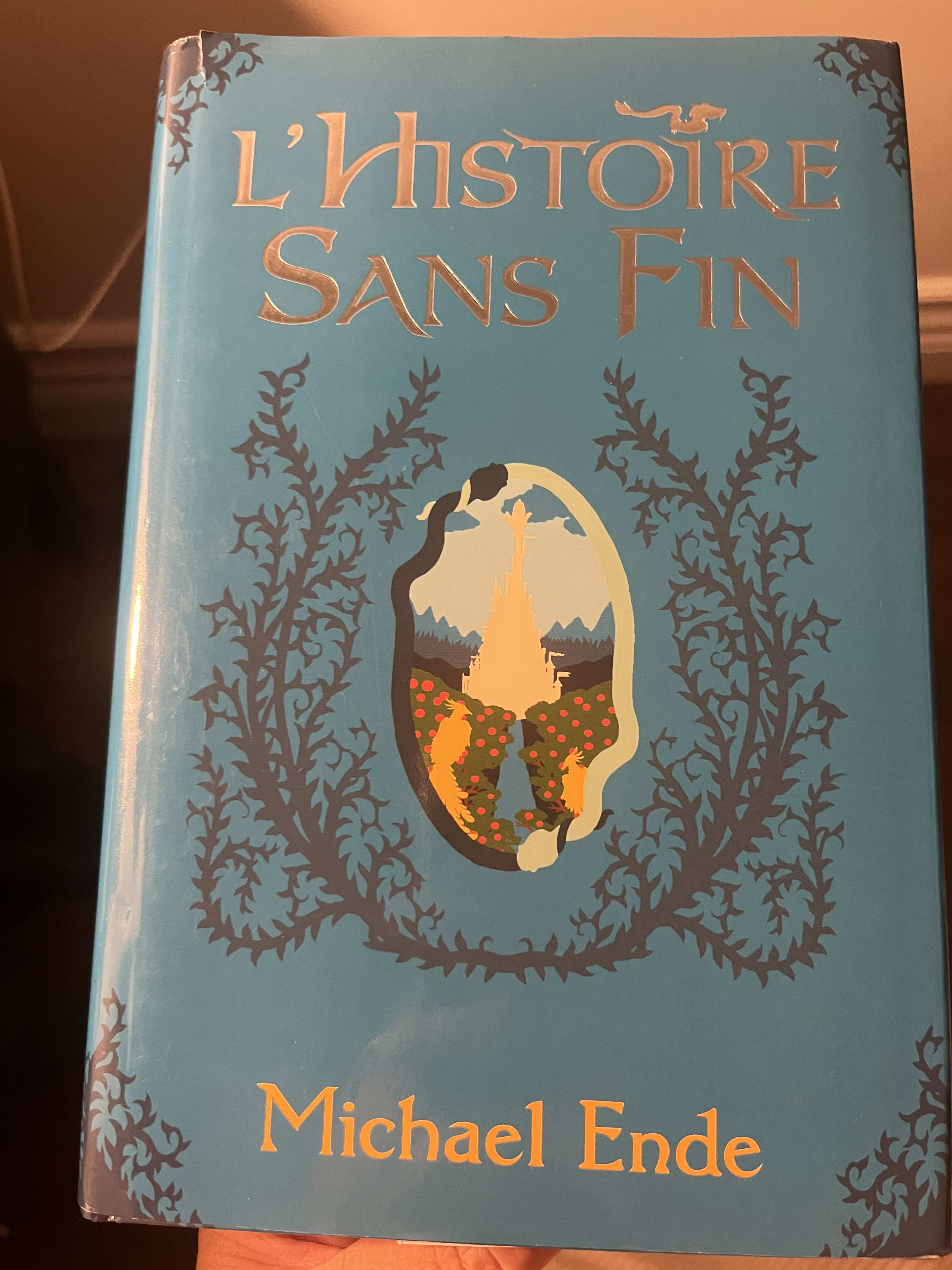 A blue cover of a book titled the Neverending story by Michael Ende