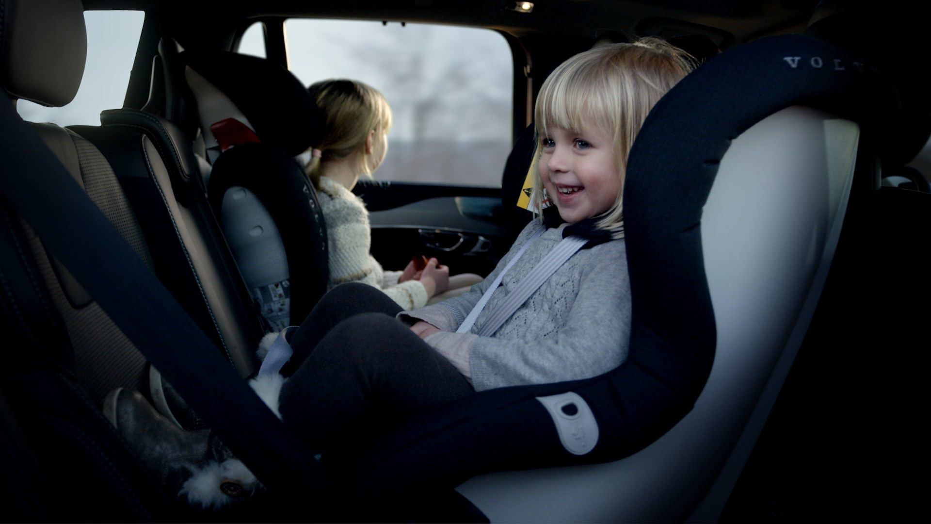 image of a smiling child in a child seat