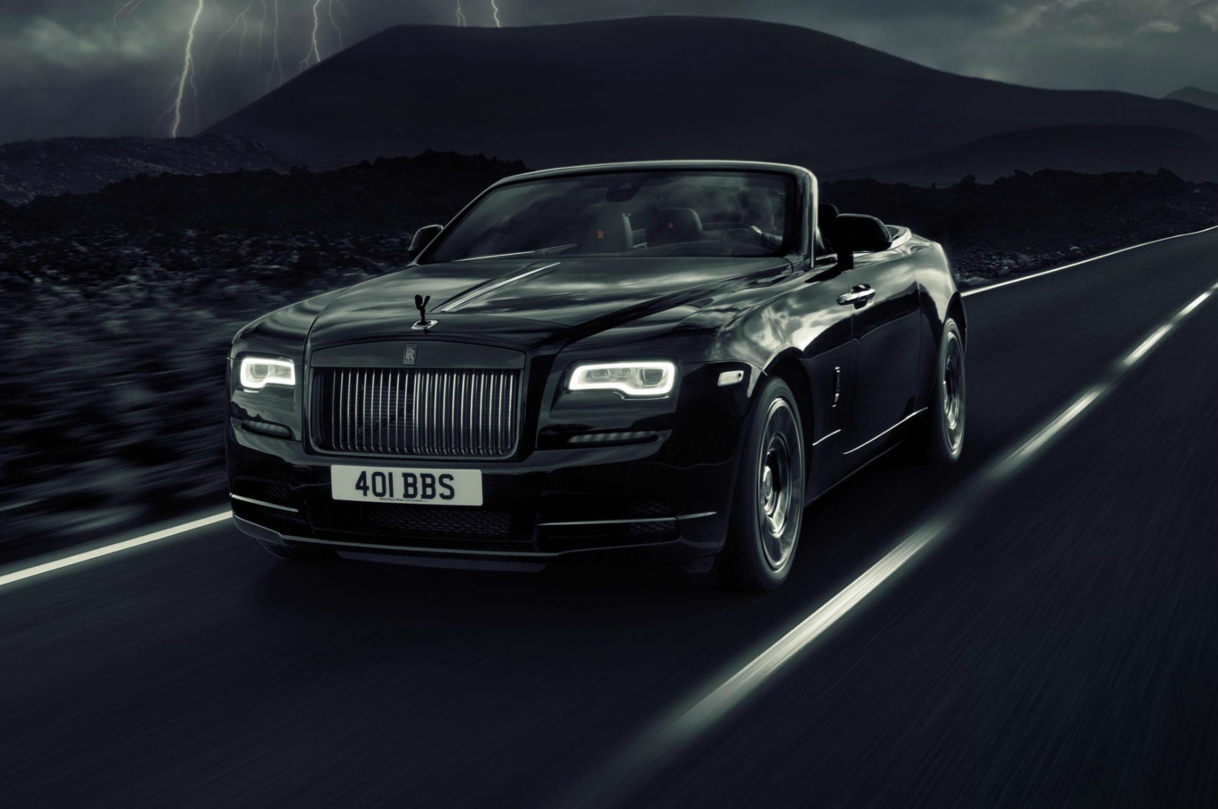 image of a black rolls royce dawn black badge car