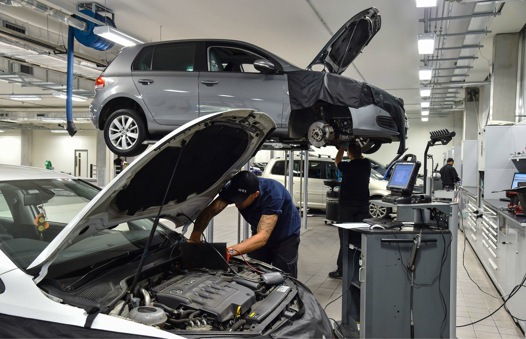 image of a silver volkswagen golf car being repaired