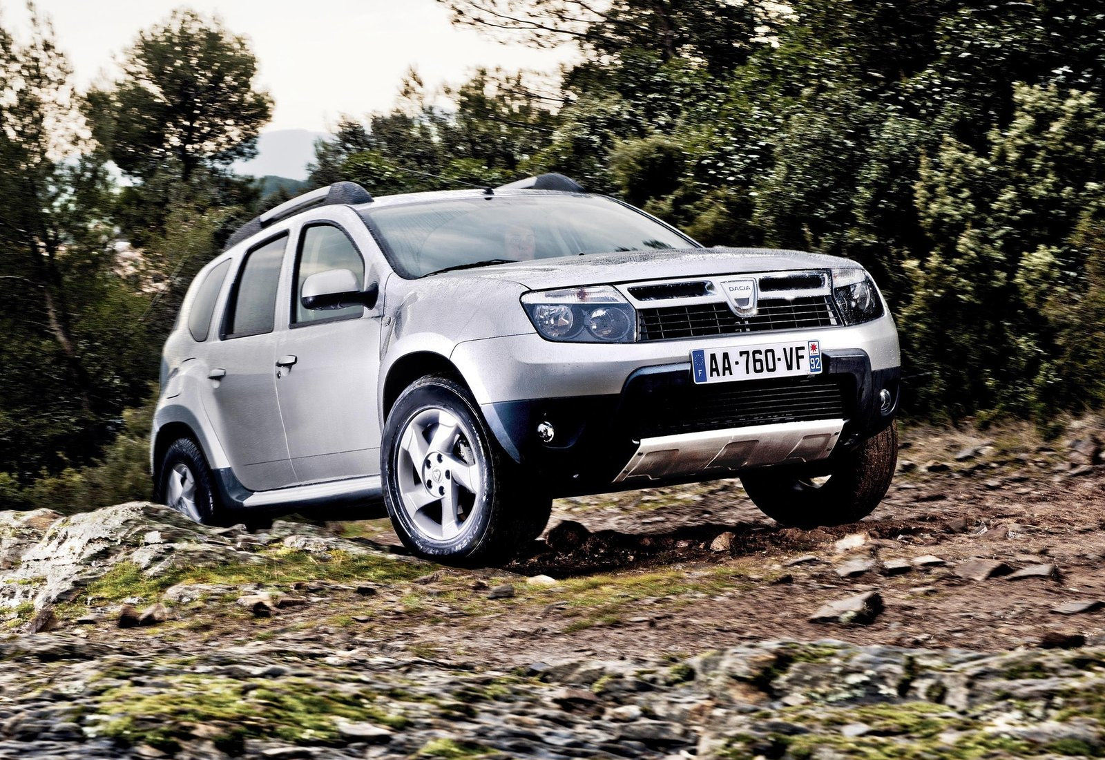 image of silver dacia duster in off road conditions