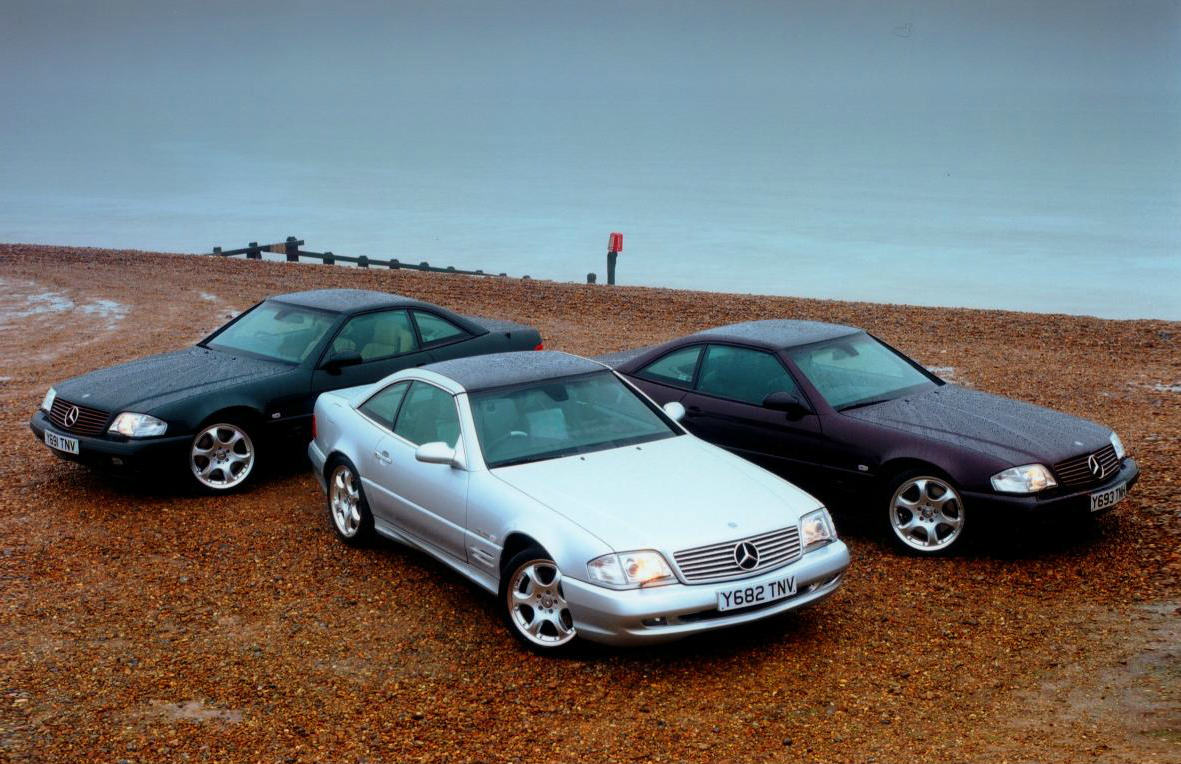 image of three mercedes-benz sl cars on a beach