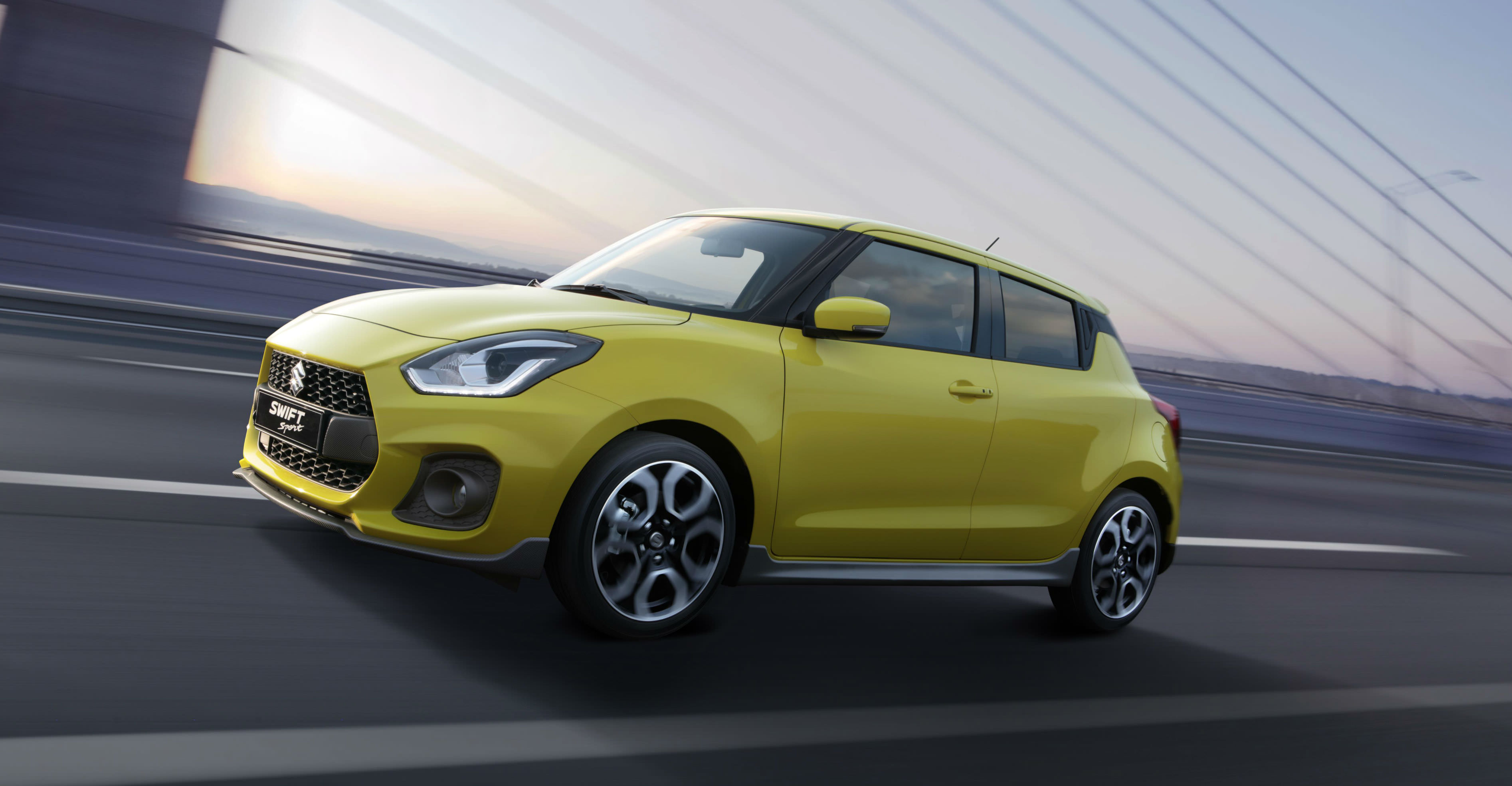 image of a yellow suzuki swift concept car at frankfurt motor show 2017