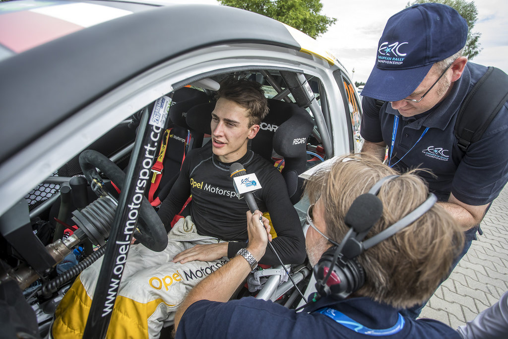 image of chris ingram rally driver being interviewed in his rally car