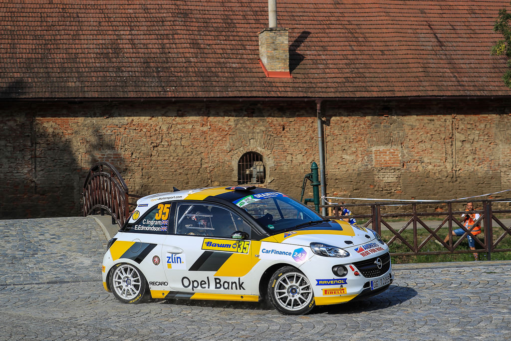 image of chris ingrams rally car racing on cobbled road