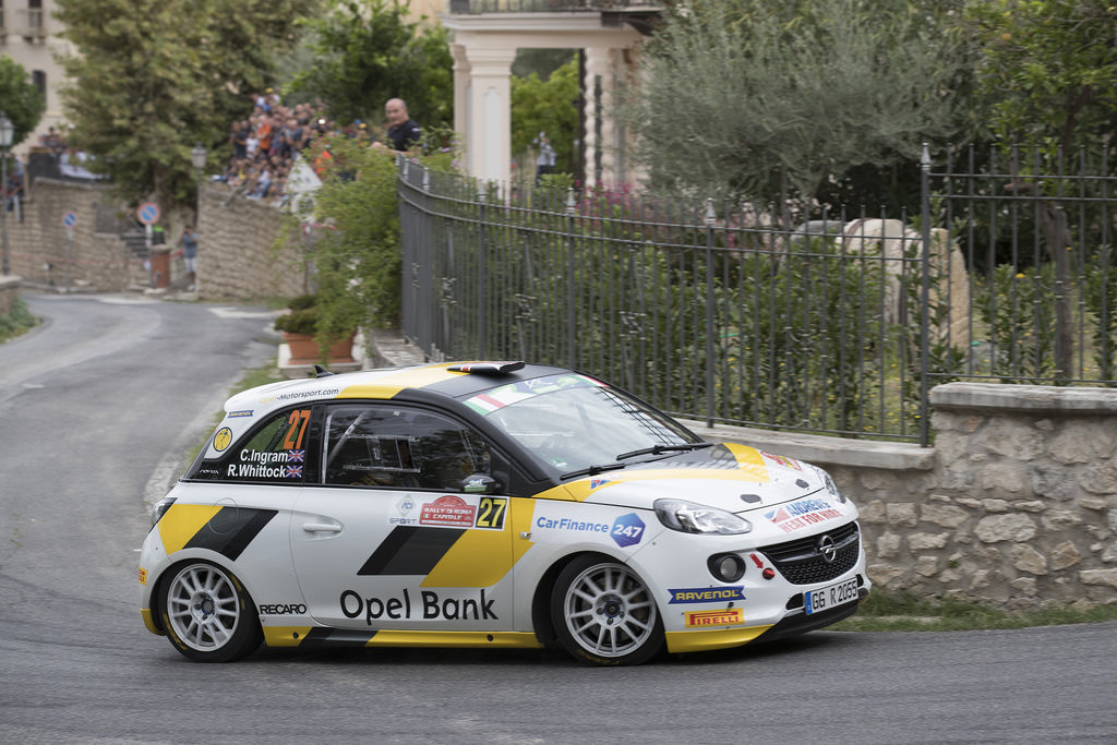 image of chris ingrams rally car racing on street road