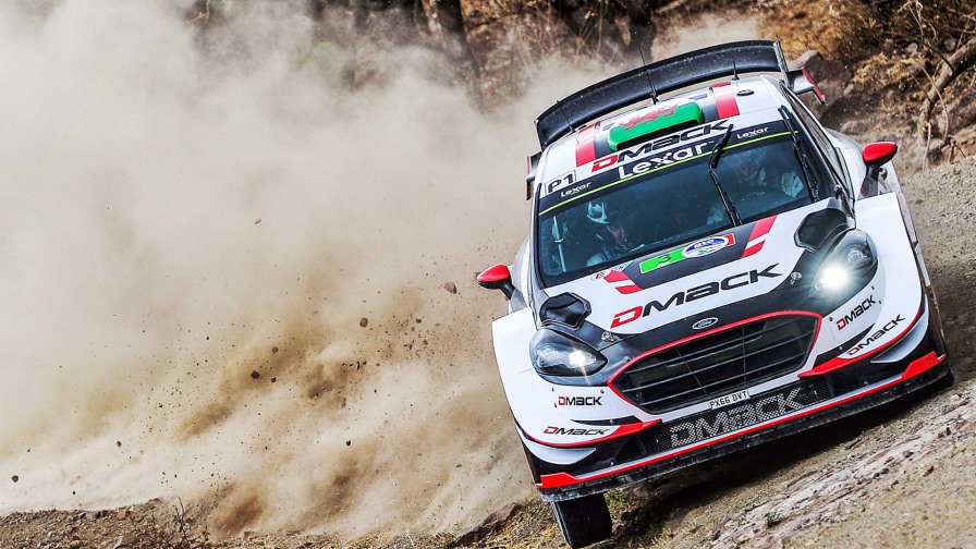 image of elfyn evans rally car kicking up dirt during a race