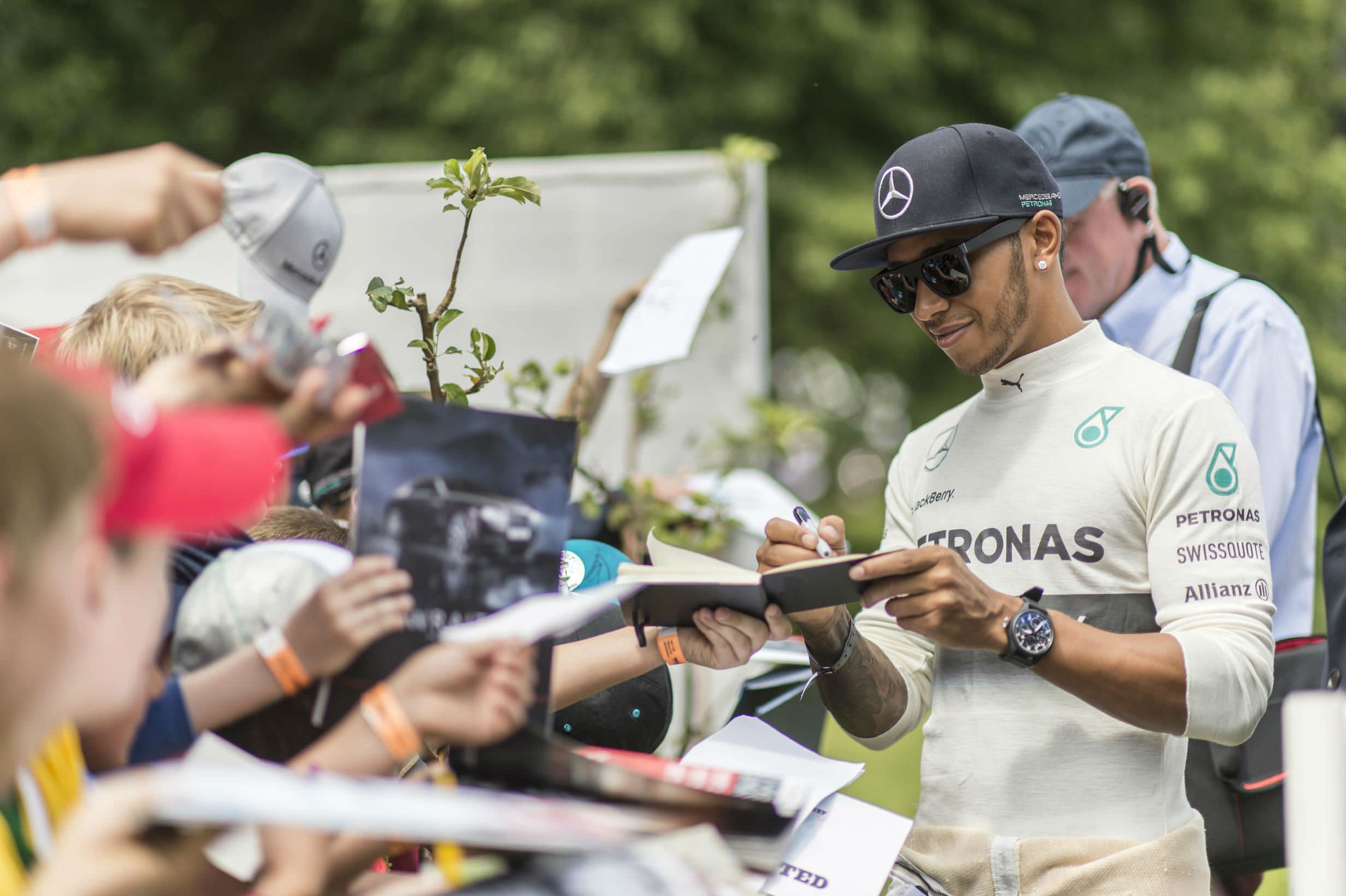 image of lewis hamilton f1 driver signing autographs