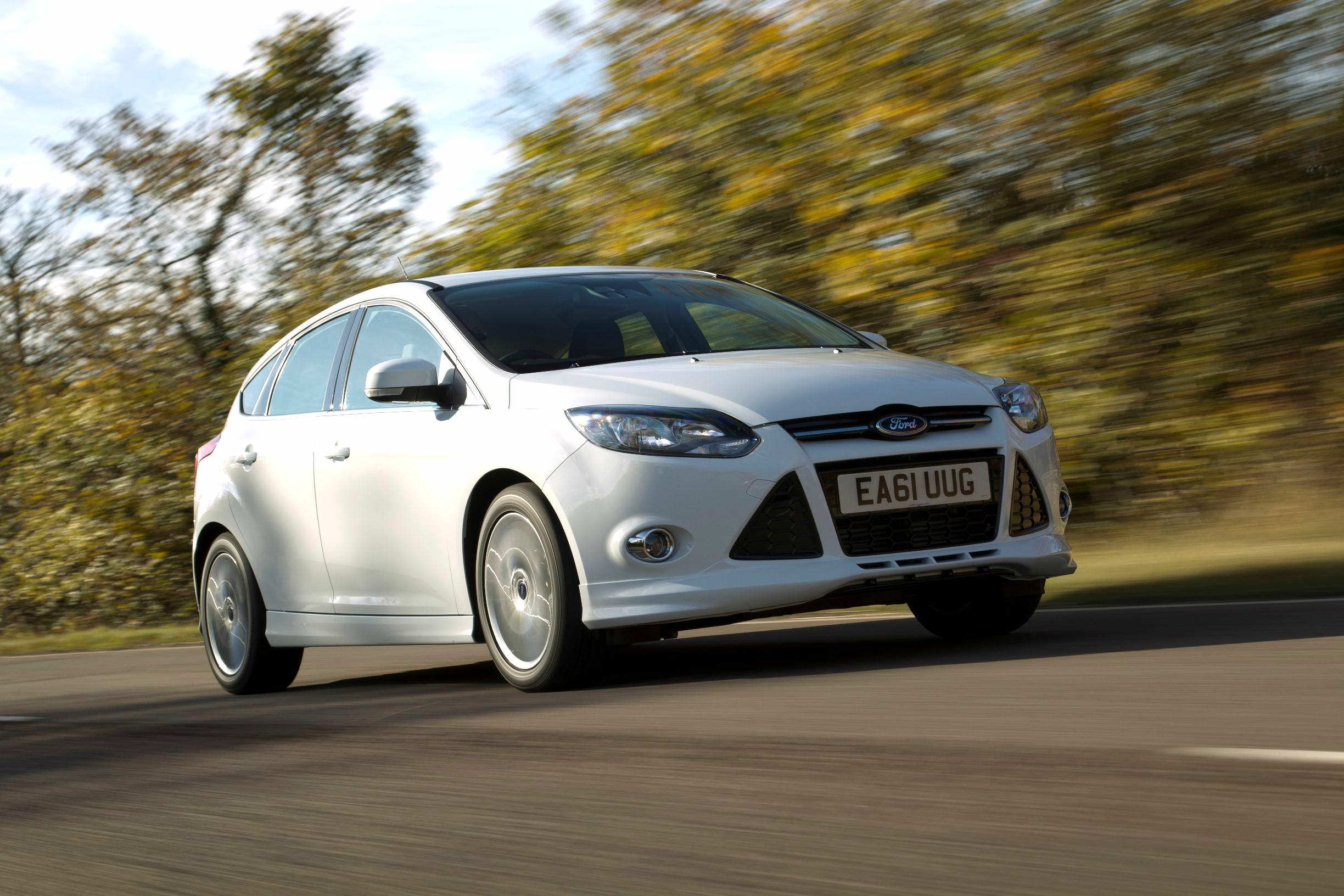 image of a white ford focus car on a country road