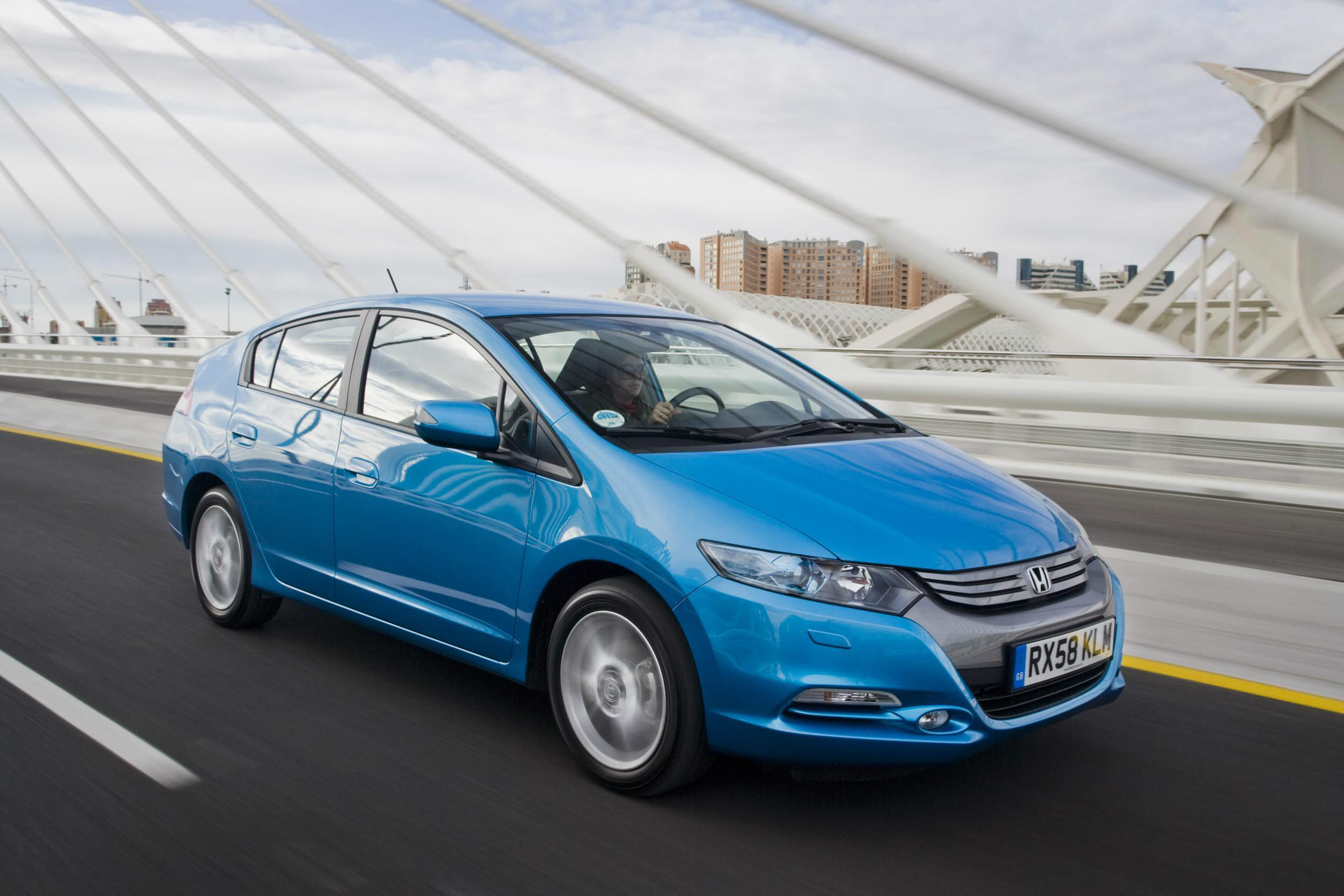 image of a dark blue honda insight car exterior