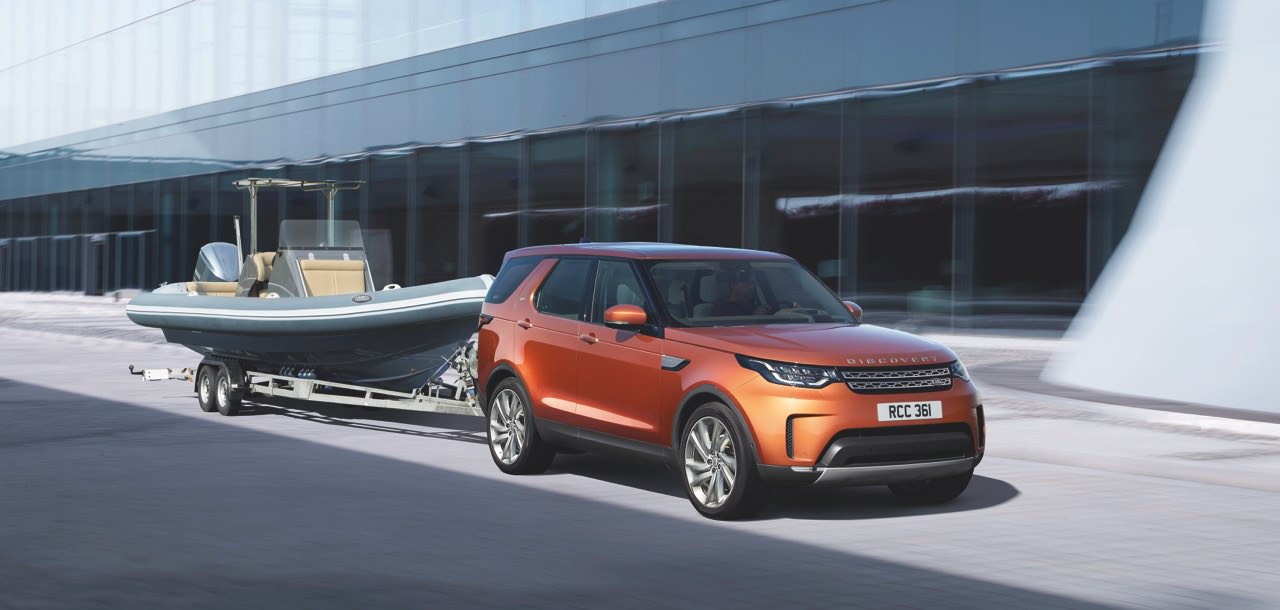 image of a land rover towing a boat