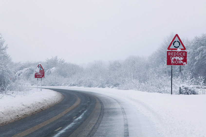 image of a dangerous road in snow and ice conditions