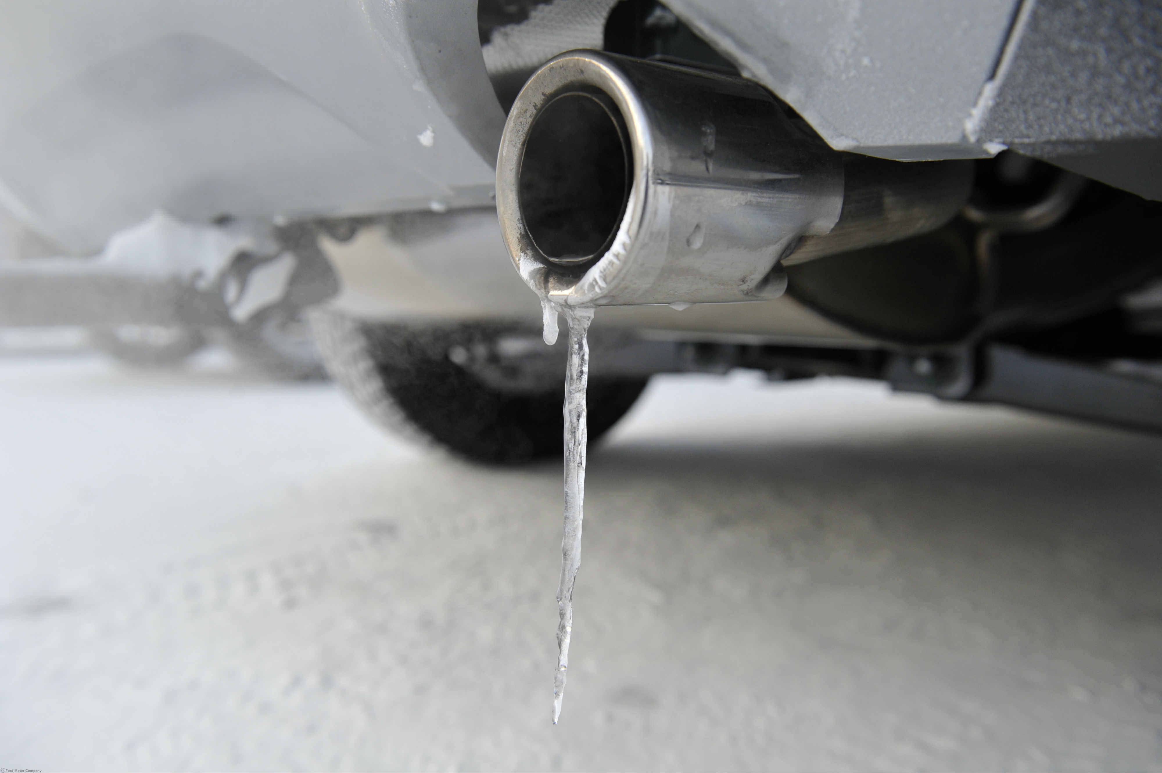 image of an icicle dripping from a car exhaust