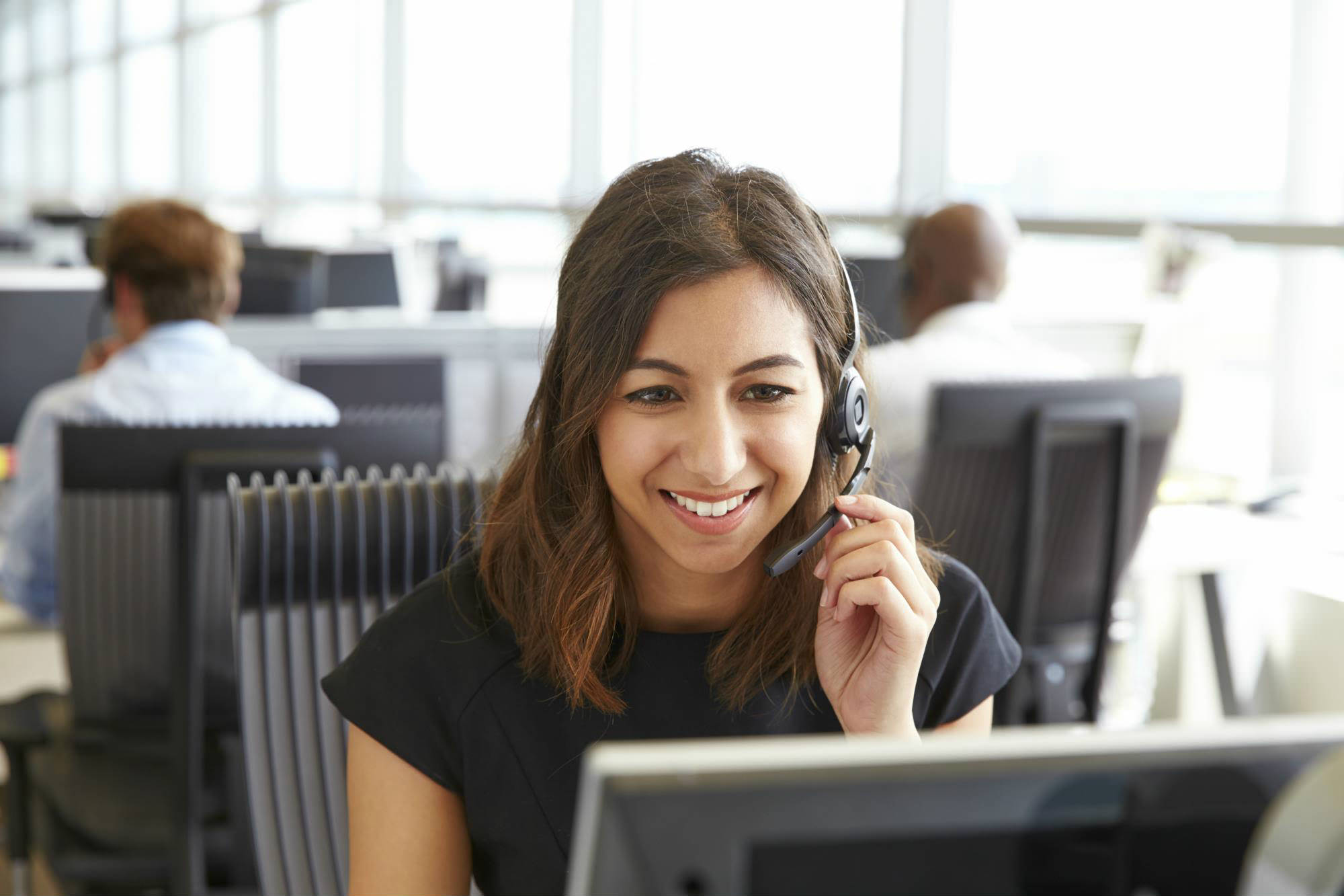 image of woman on a headset