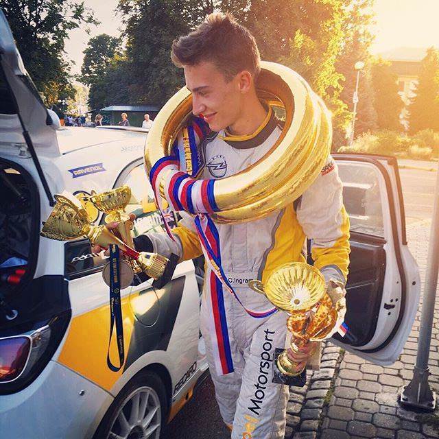 image of chris ingram rally driver with trophies