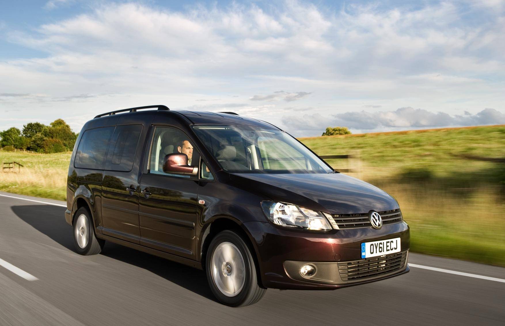 image of a black volkswagen caddy car van exterior