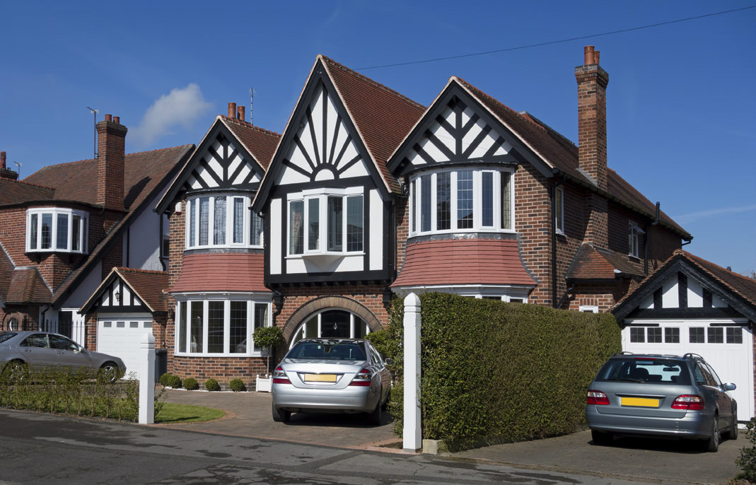 image of cars parked in private driveways