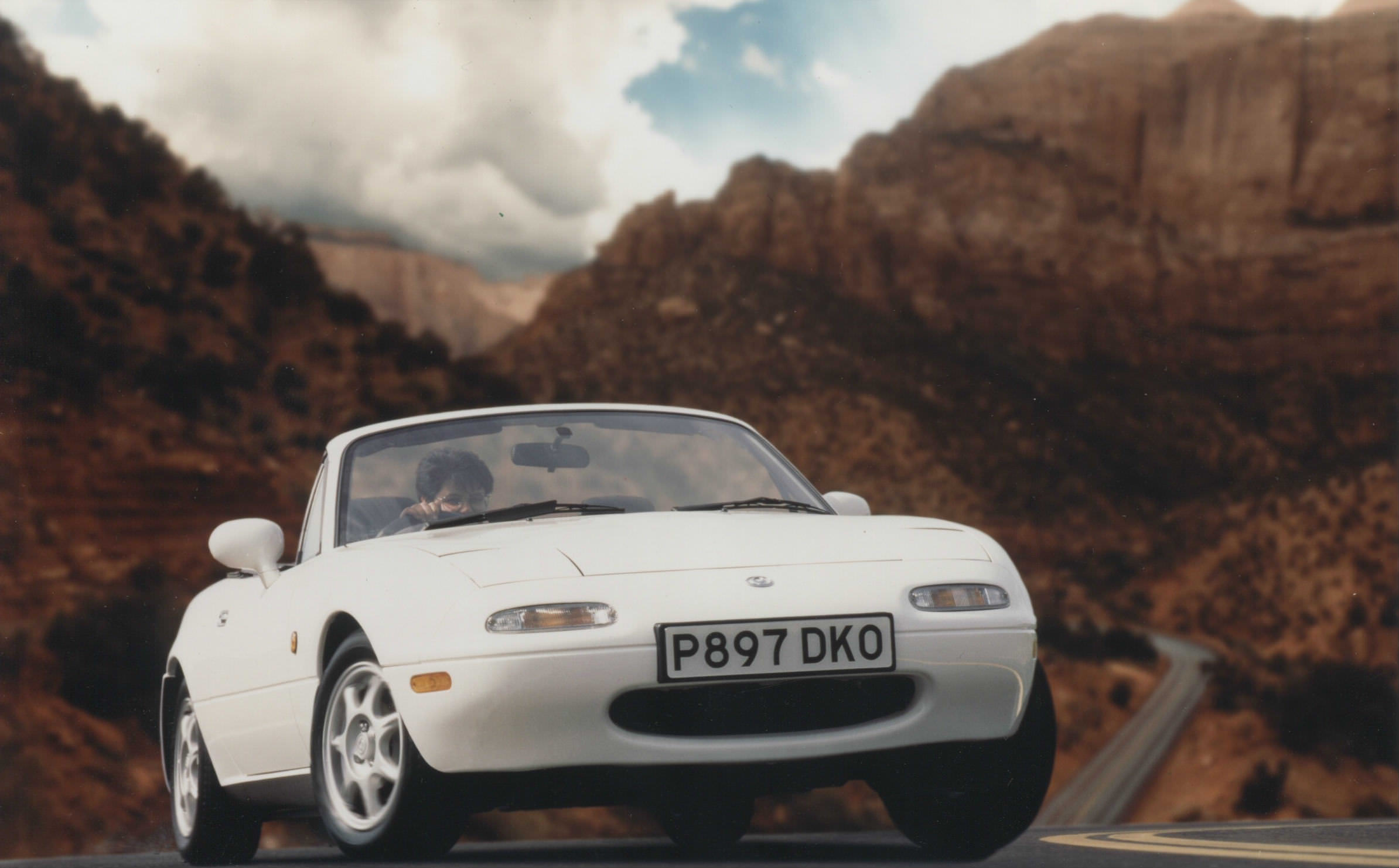 image of a vintage white mazda mx 5 car exterior