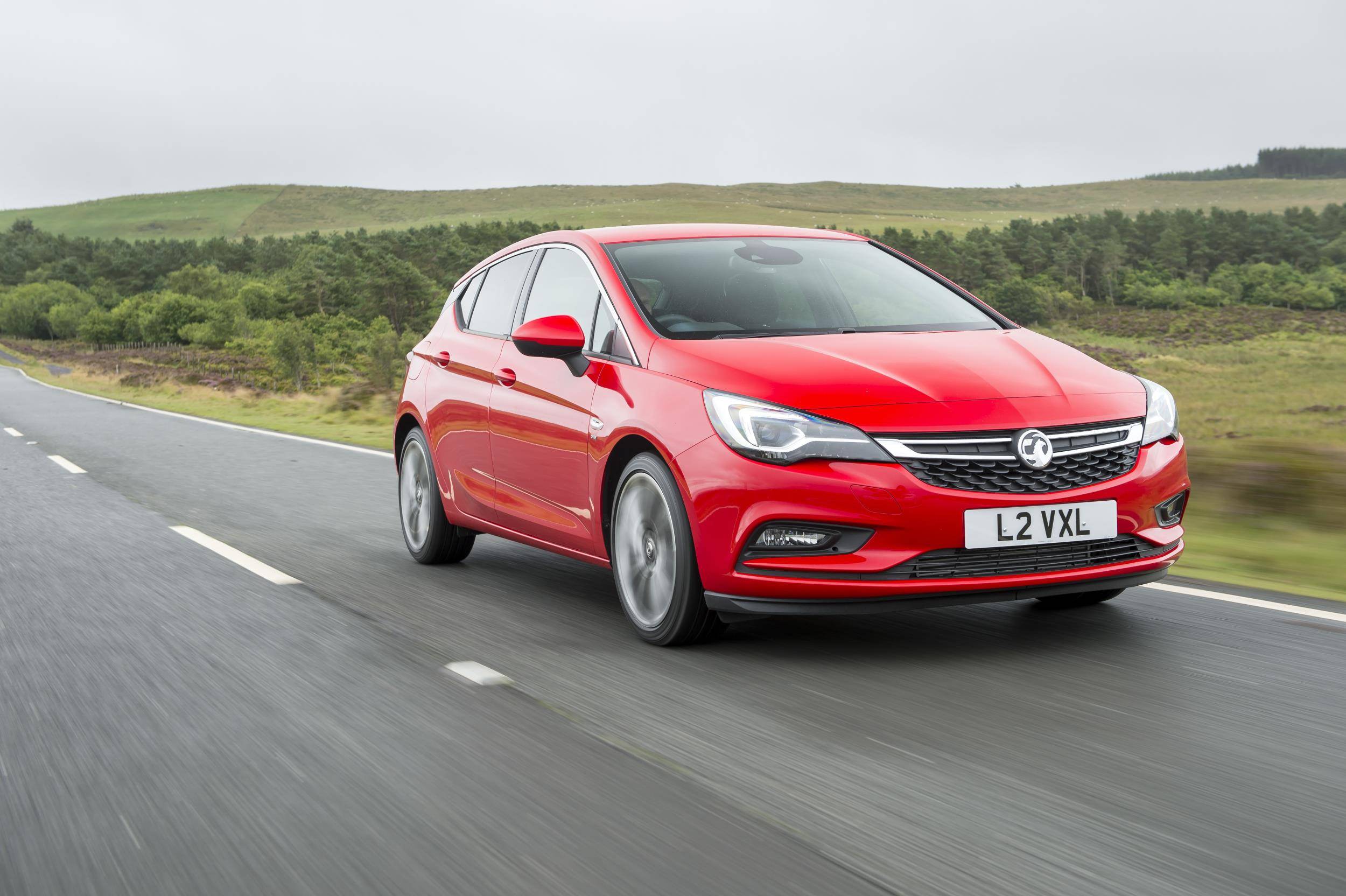 image of a red vauxhall astra car exterior