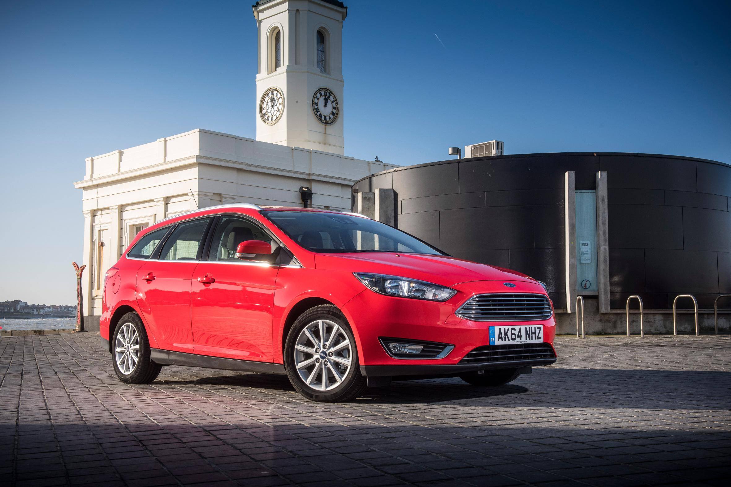 image of a red ford focus estate car exterior