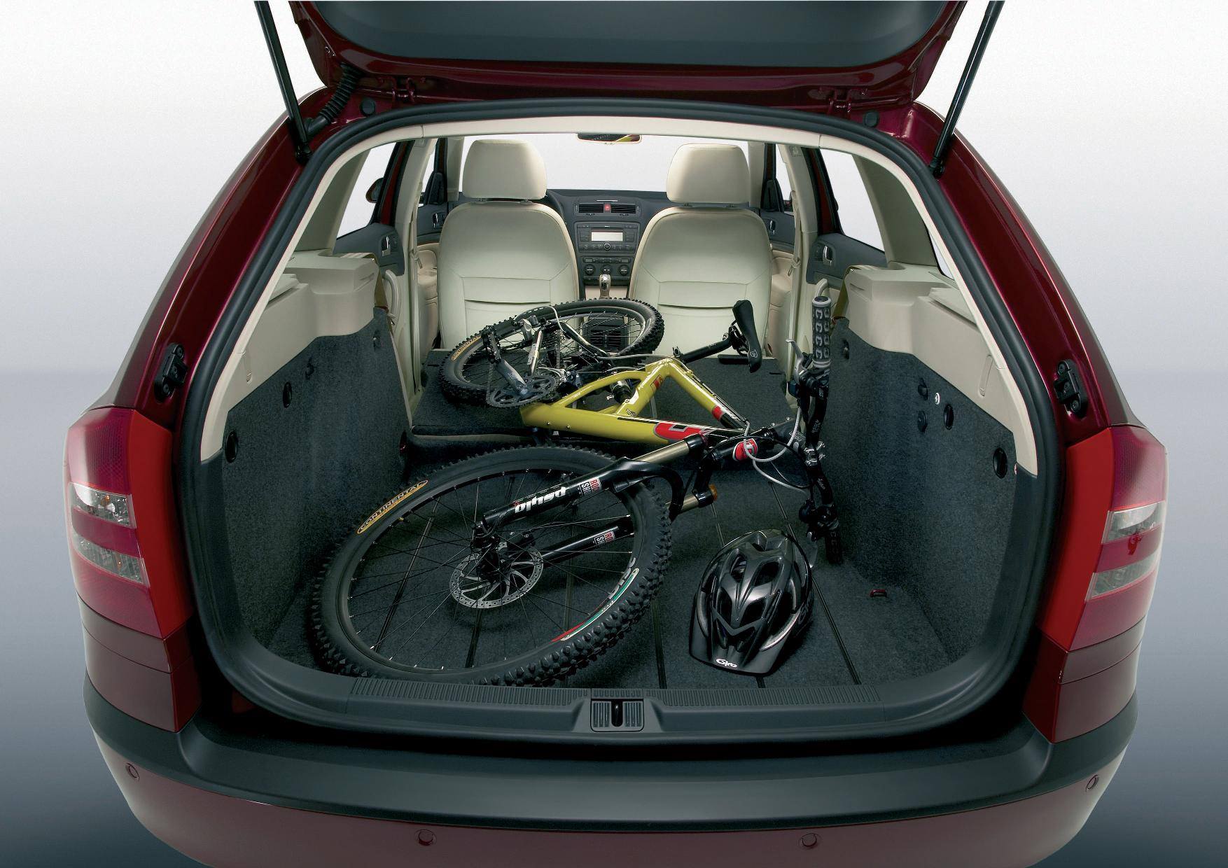 image of a red skoda octavia estate car with a bike in the boot