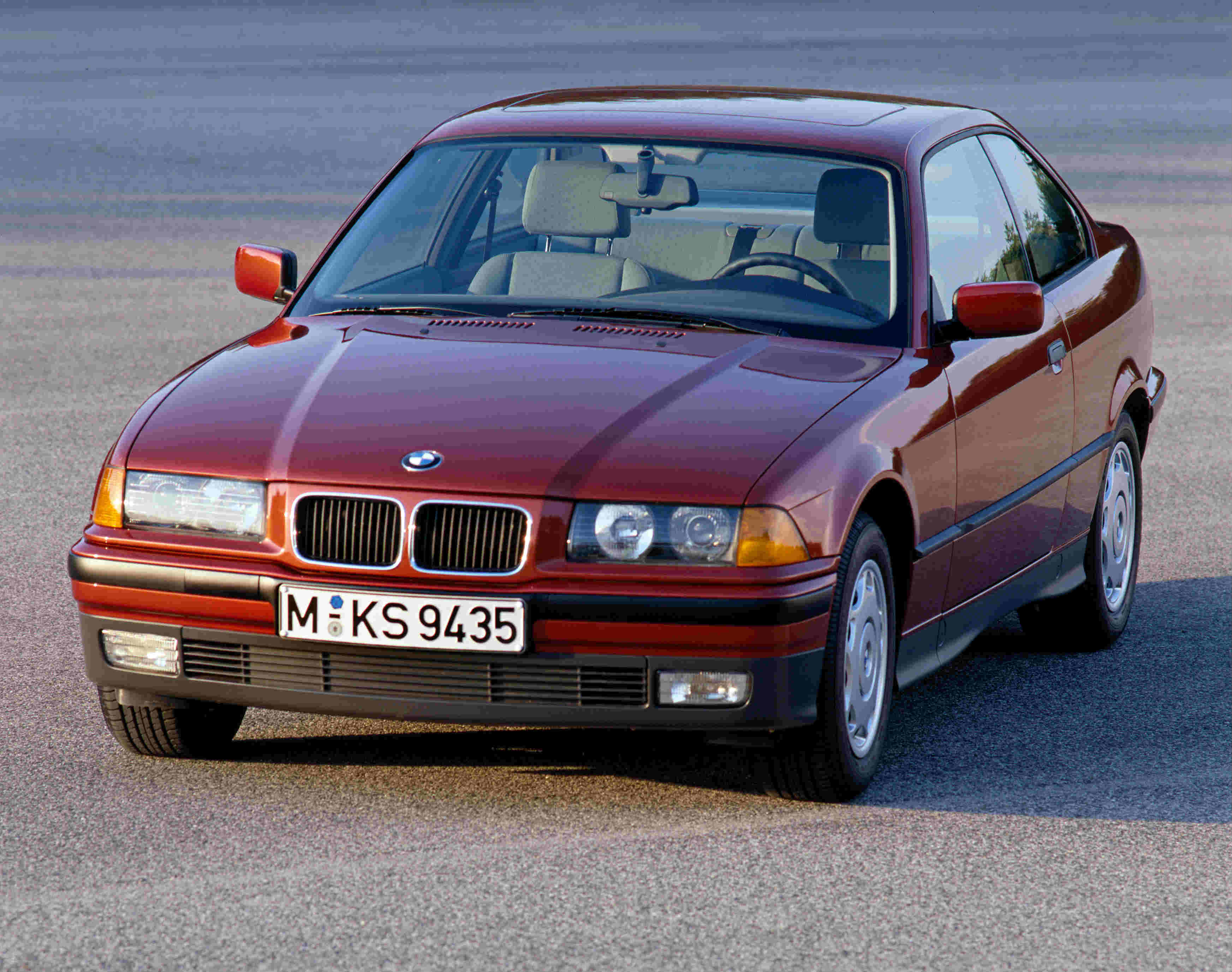 image of a red bmw 3 series car exterior