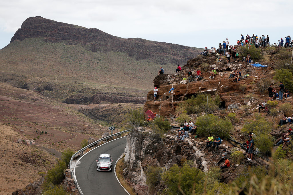 image of chris ingrams rally car going up a hill in a rally race