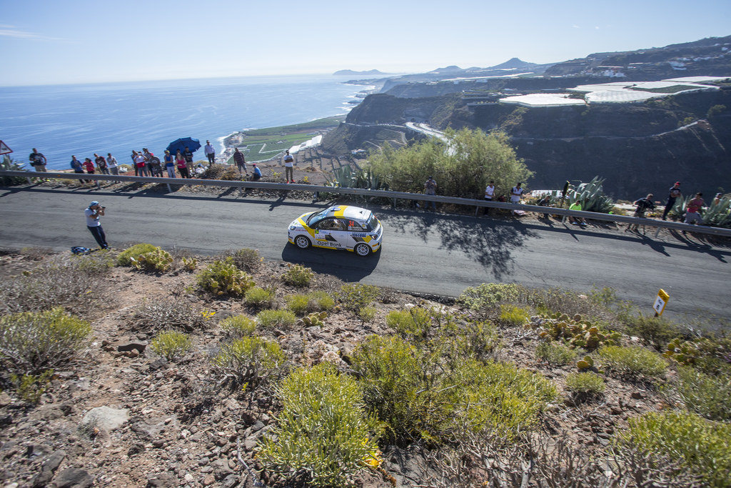 image of chris ingrams rally car going round a corner in a rally race