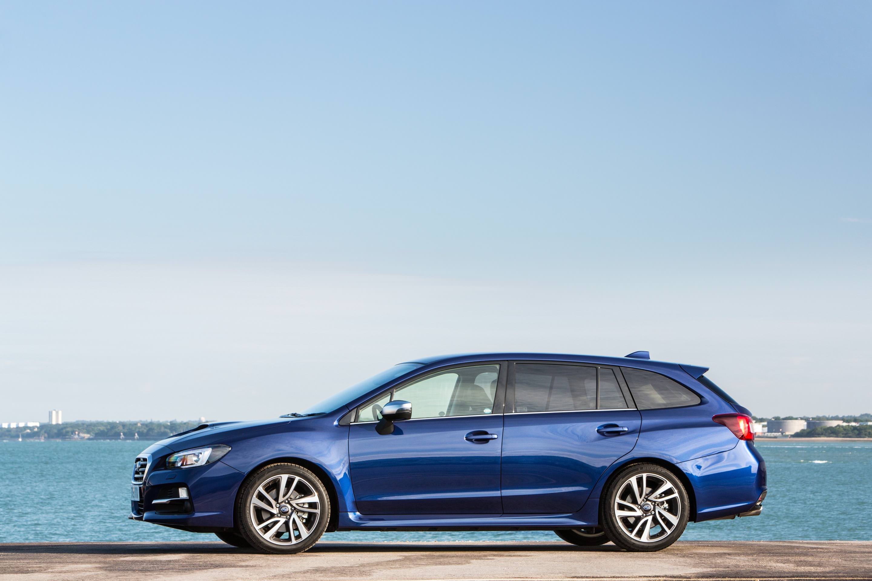Used Blue Subaru parked besides the Sea