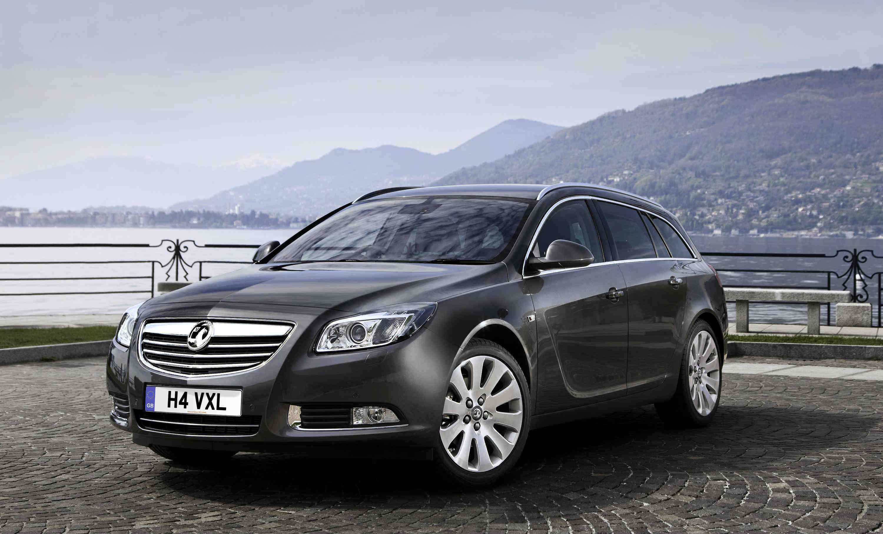 Black Vauxhall Insignia parked besides the sea