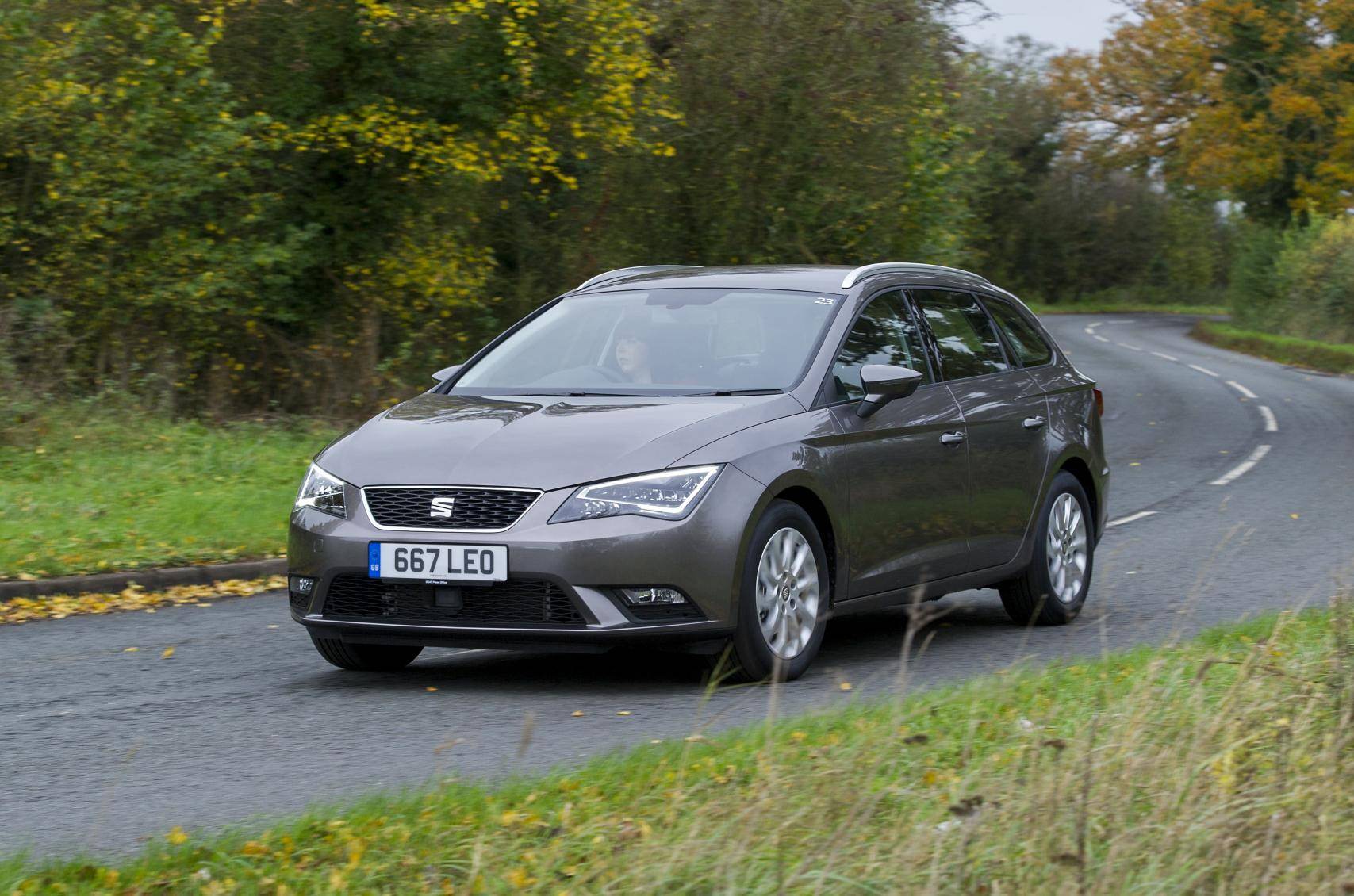 Grey Seat Leon driving on countryside road