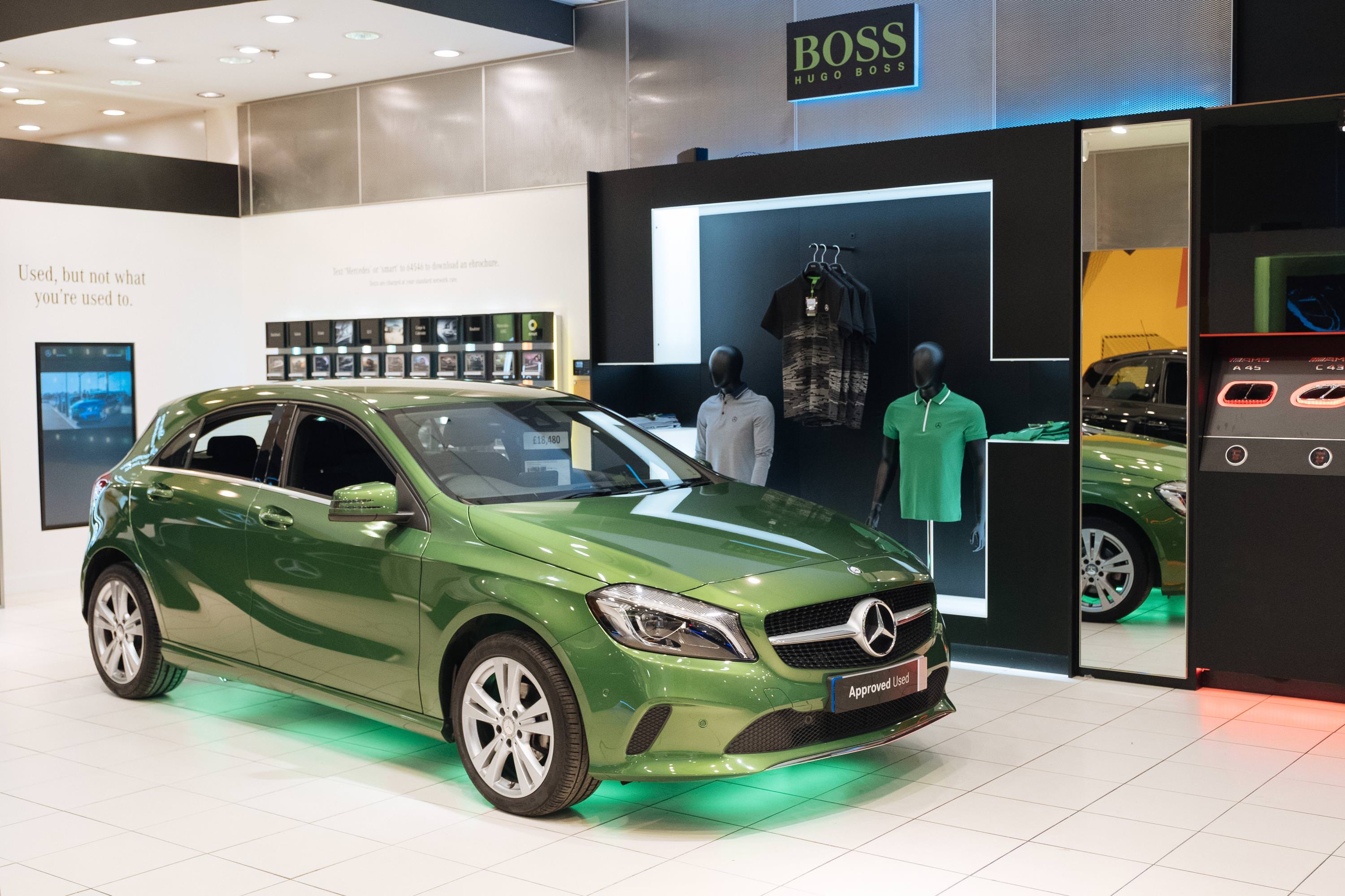 Candy Apple Green Mercedes parked inside retail shop