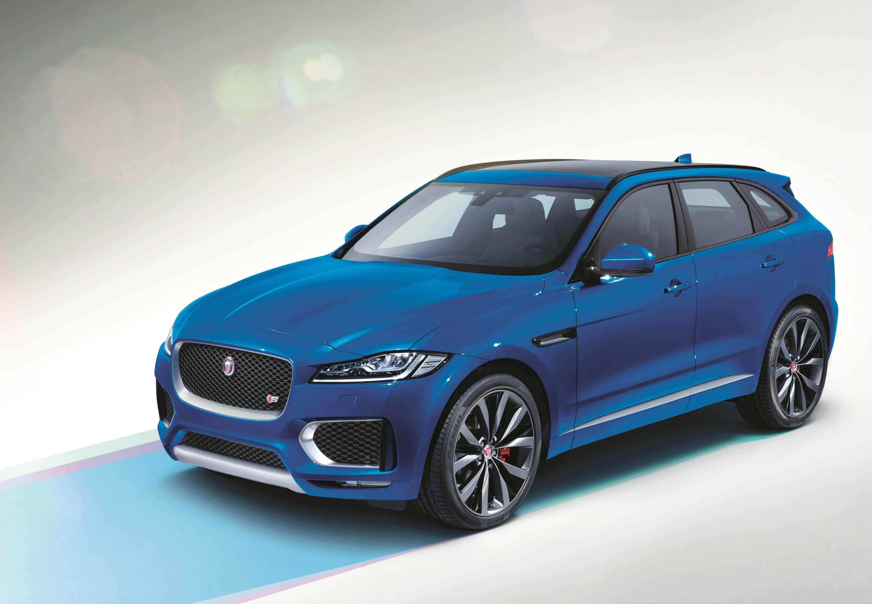 image of a blue jaguar f pace car exterior