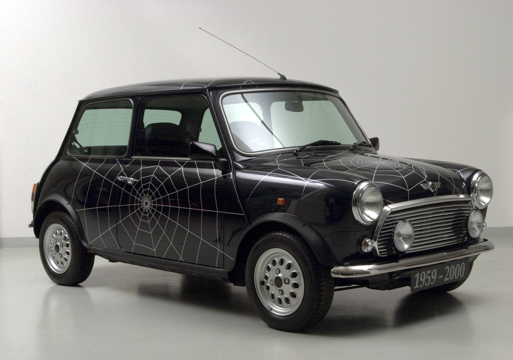 image of a black vintage mini cooper car exterior with spider web design