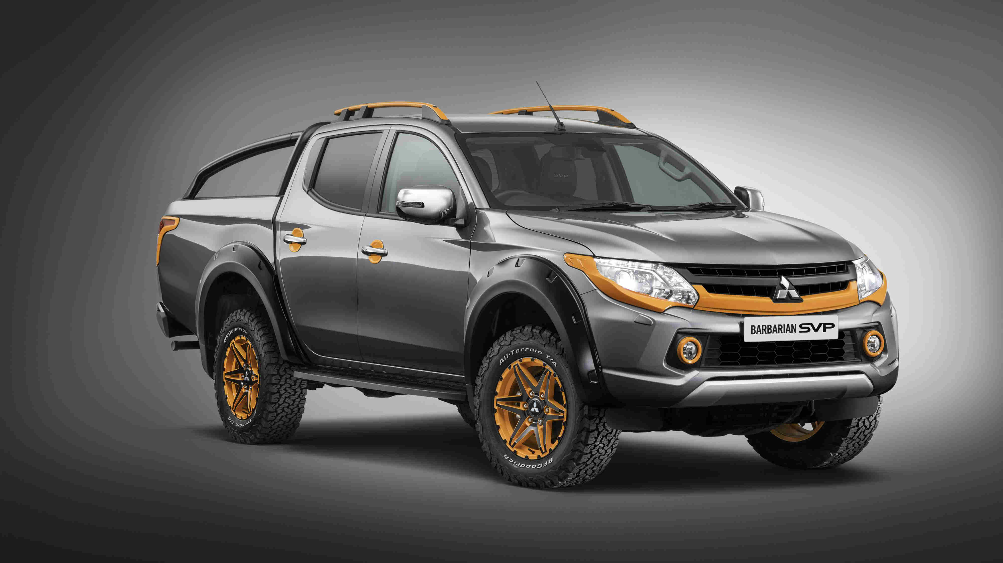 image of a grey and orange mitsubishi l200 barbarian car exterior