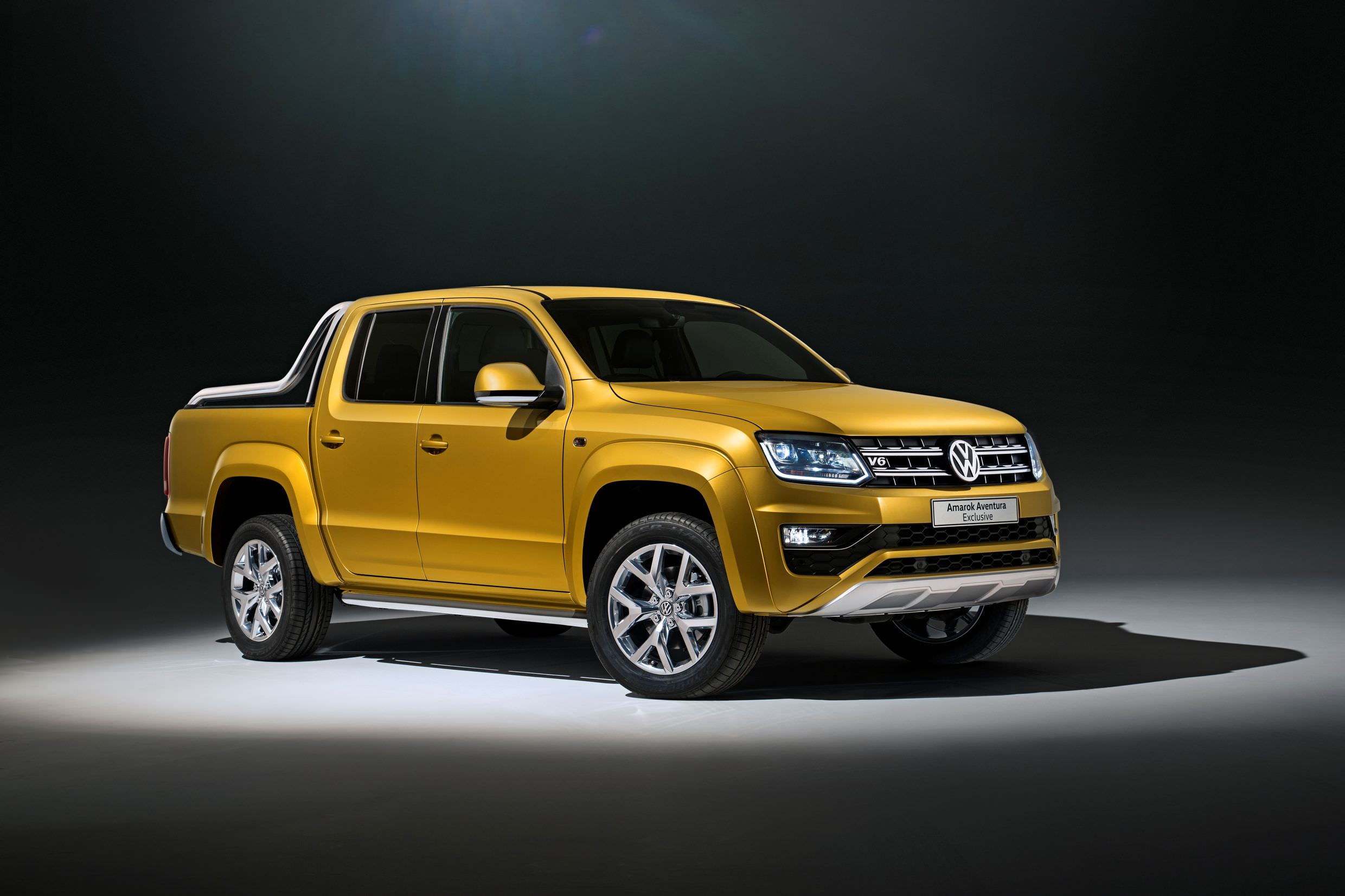 image of a yellow volkswagen amarok car exterior