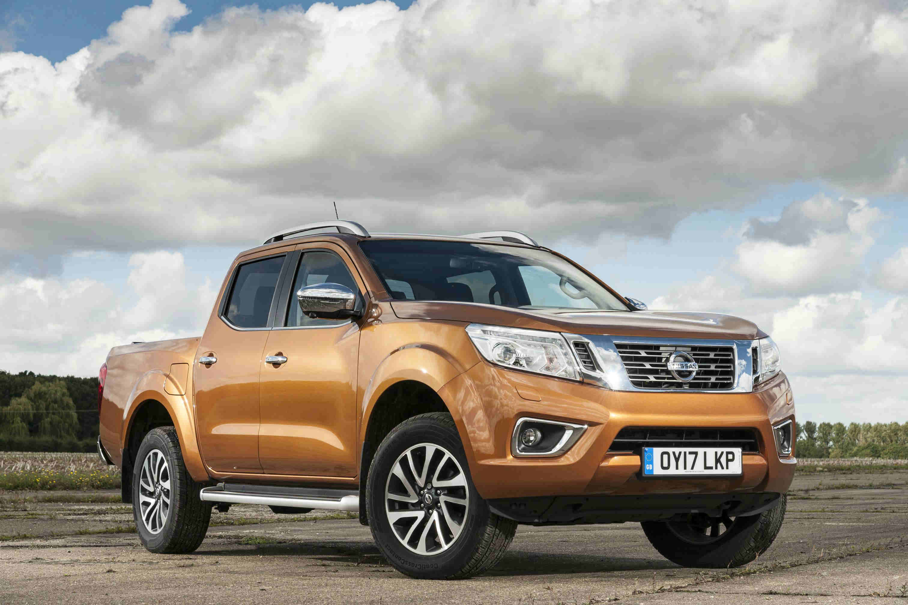 image of an orange nissan navara car exterior