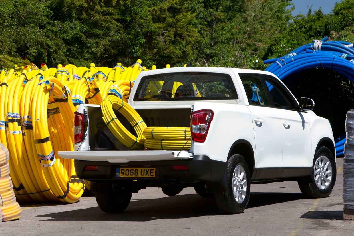 image of a white ssangyong musso car exterior