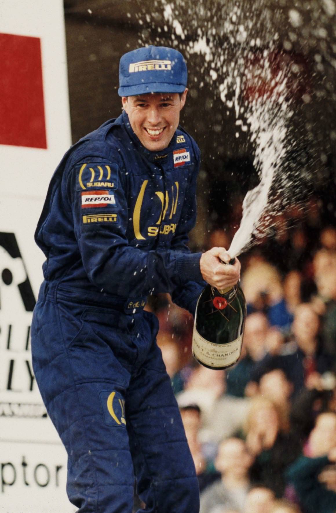 Colin McRae sprays champagne after winning the WRC title in 1995