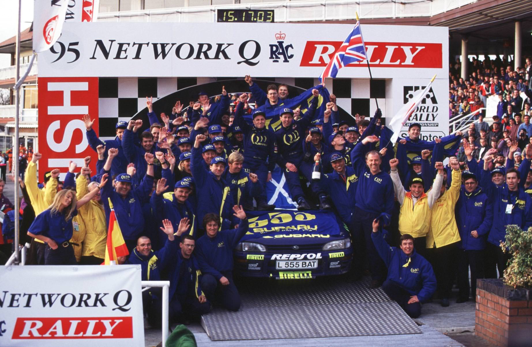 image of colin mcrae and subaru team on the winners podium in 1995