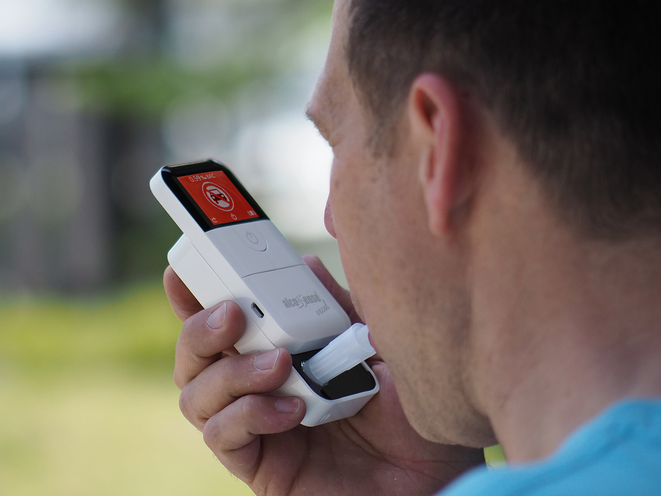 man using breathalyser