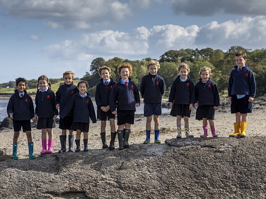Two children learning through play outside at our private primary school