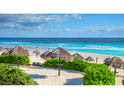 white sand beach with beach umbrellas