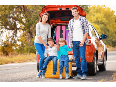 family standing next to car boot filled with luggage