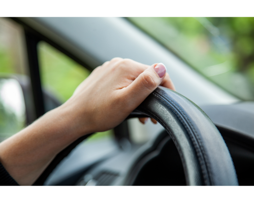 hand on steering wheel