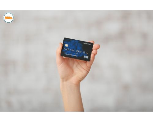 debit card held aloft